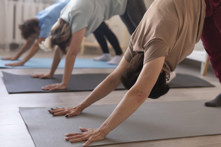 senior-women-doing-yoga-relaxing-together