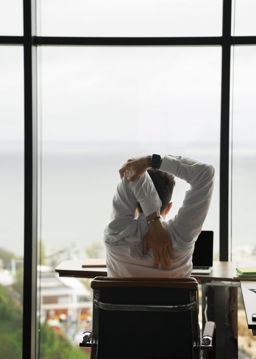 back-view-man-stretching-work