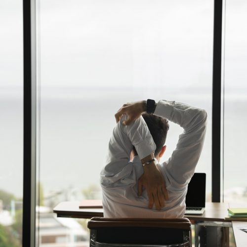 back-view-man-stretching-work