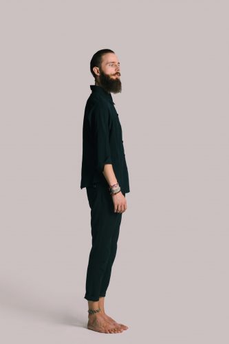 Hipster style bearded man black shirt in studio over white background