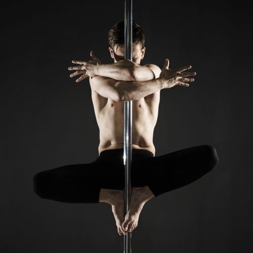 portrait-young-male-model-pole-dancing