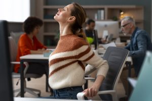 woman-office-stretching-work-day